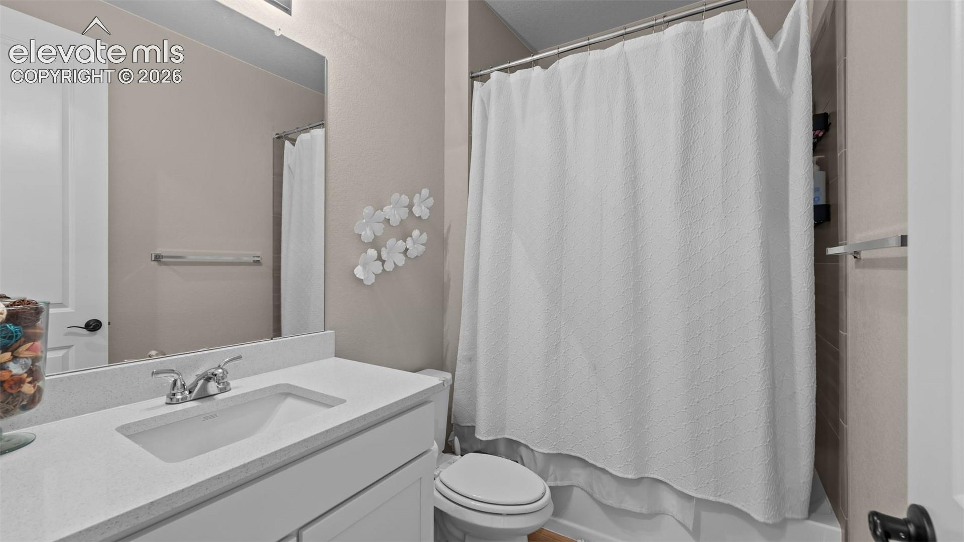 Built-in vanity with a single basin sink and a chrome-finish faucet