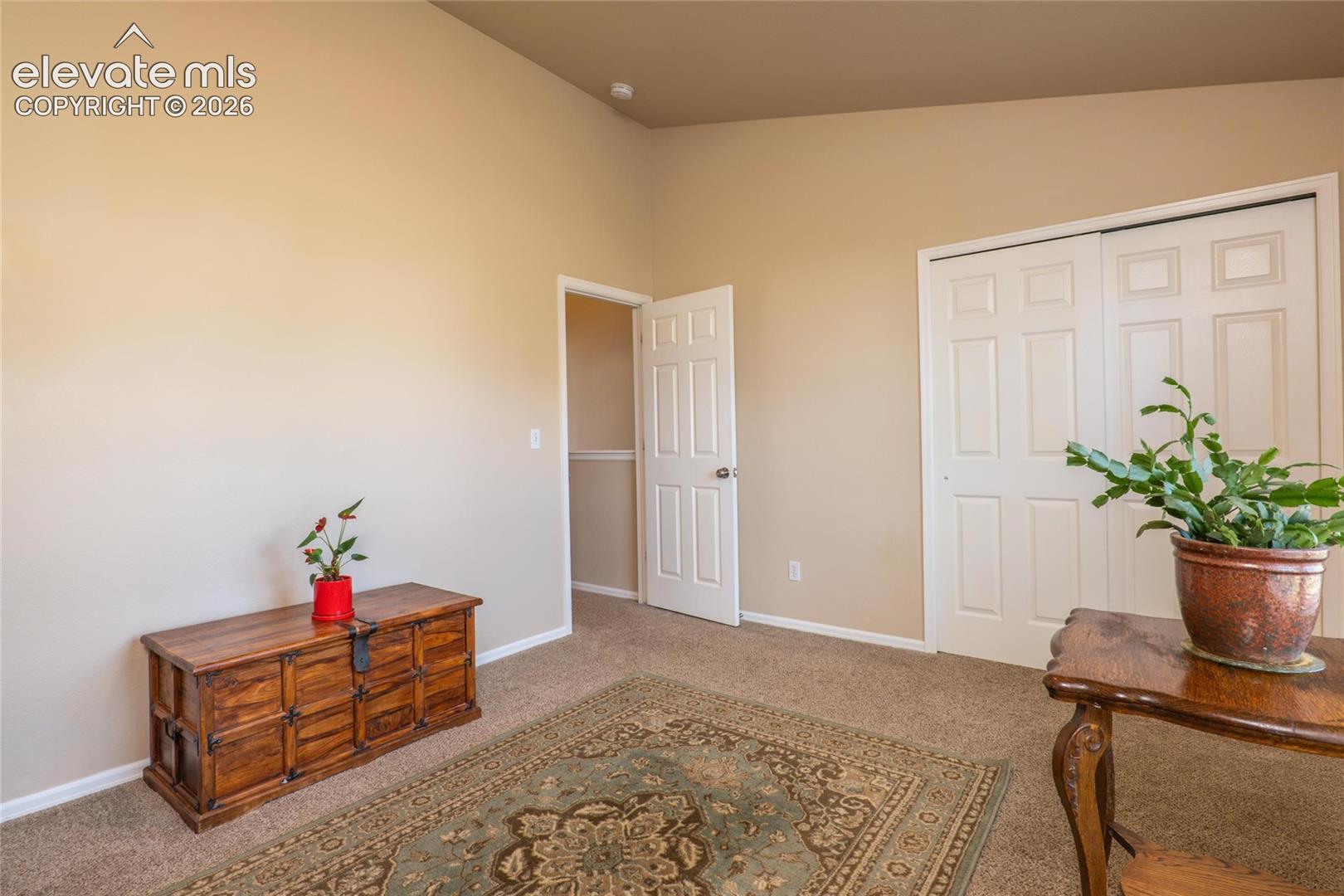 Spacious 2nd upper level bedroom with vaulted ceiling.