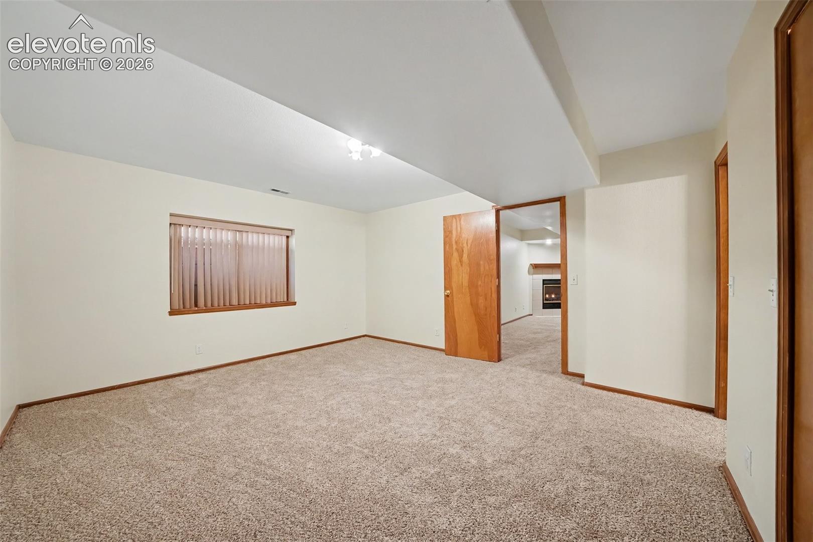 Additional basement bedroom with new carpeting