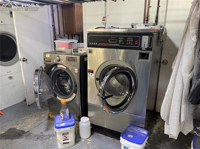 Laundry room with concrete floors and separate washer and dryer