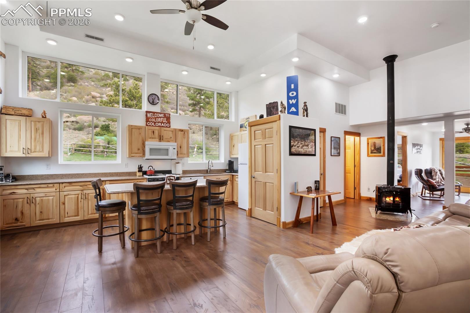 A nice big kitchen with windows that will draw you in like a good novel telling you the most beautiful story.