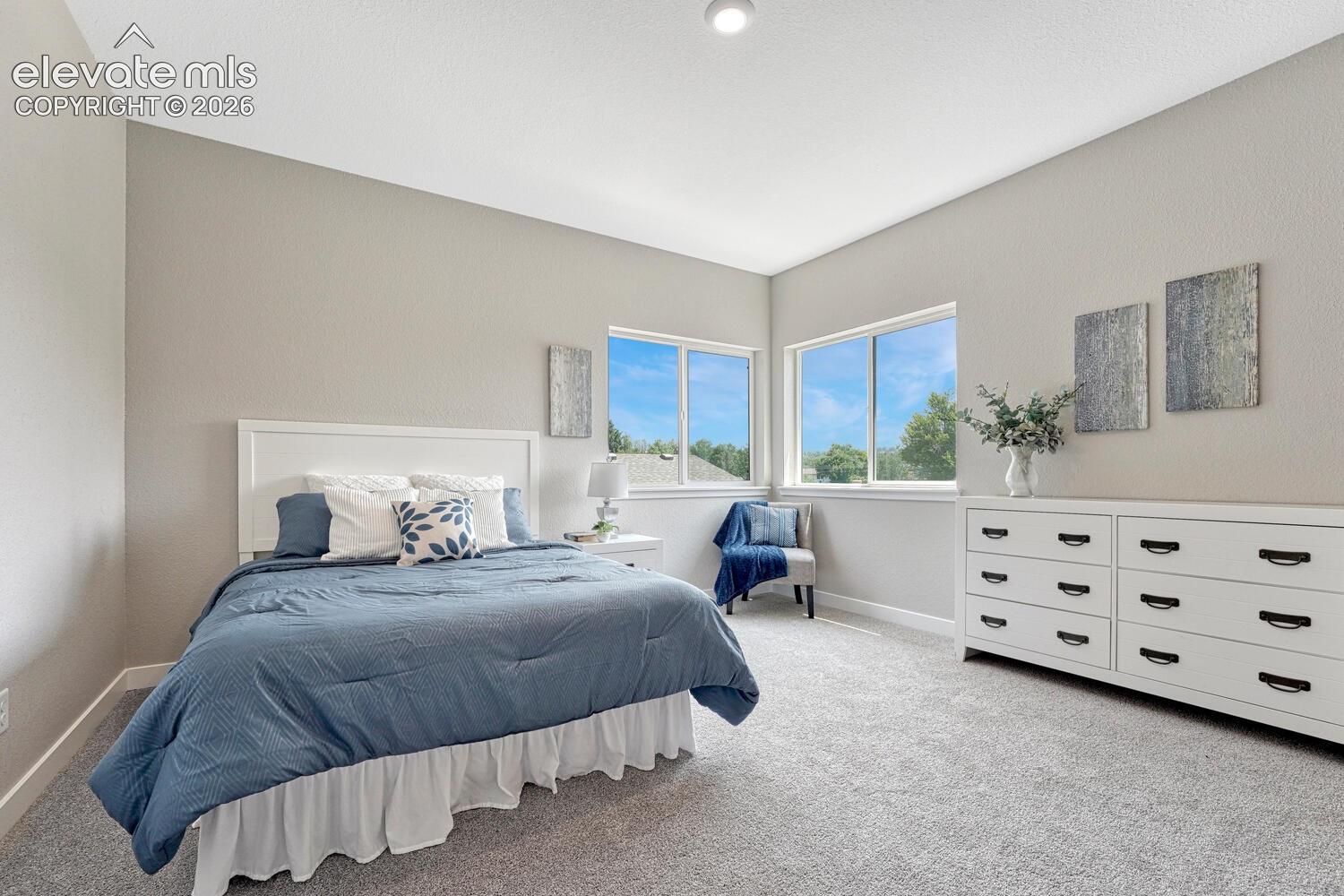 9 ft ceilings on the upper level. Primary bedroom glows with natural light.