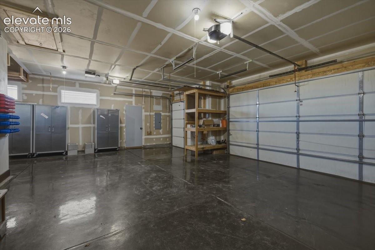 3 car garage with cabinets