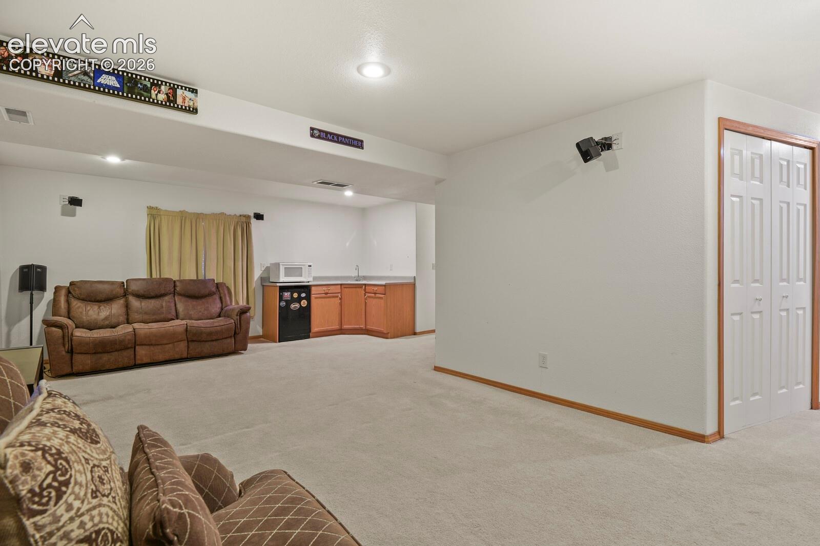 Downstairs Family Room with wet bar in the corner.