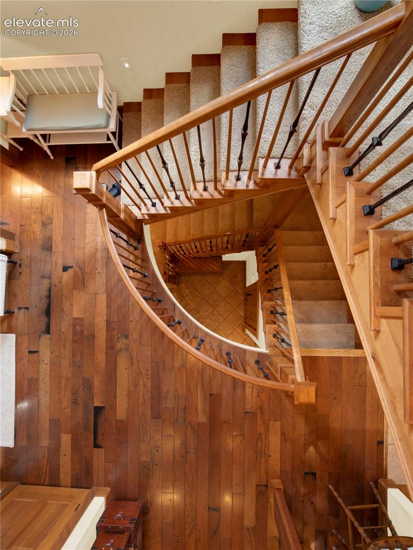 Beautiful stair case that goes from the loft all the way to the basement