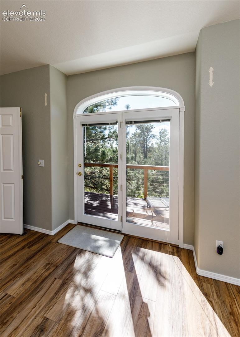  wooden deck with metal cable railing off Primary Bedroom