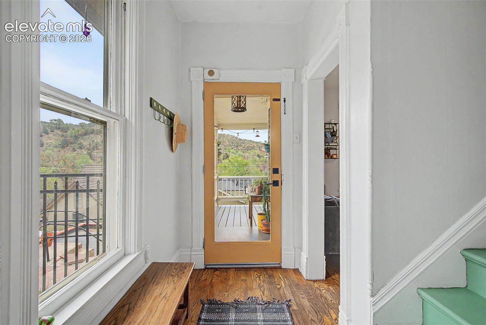 Entry way featuring hardwood flooring and windowed front door