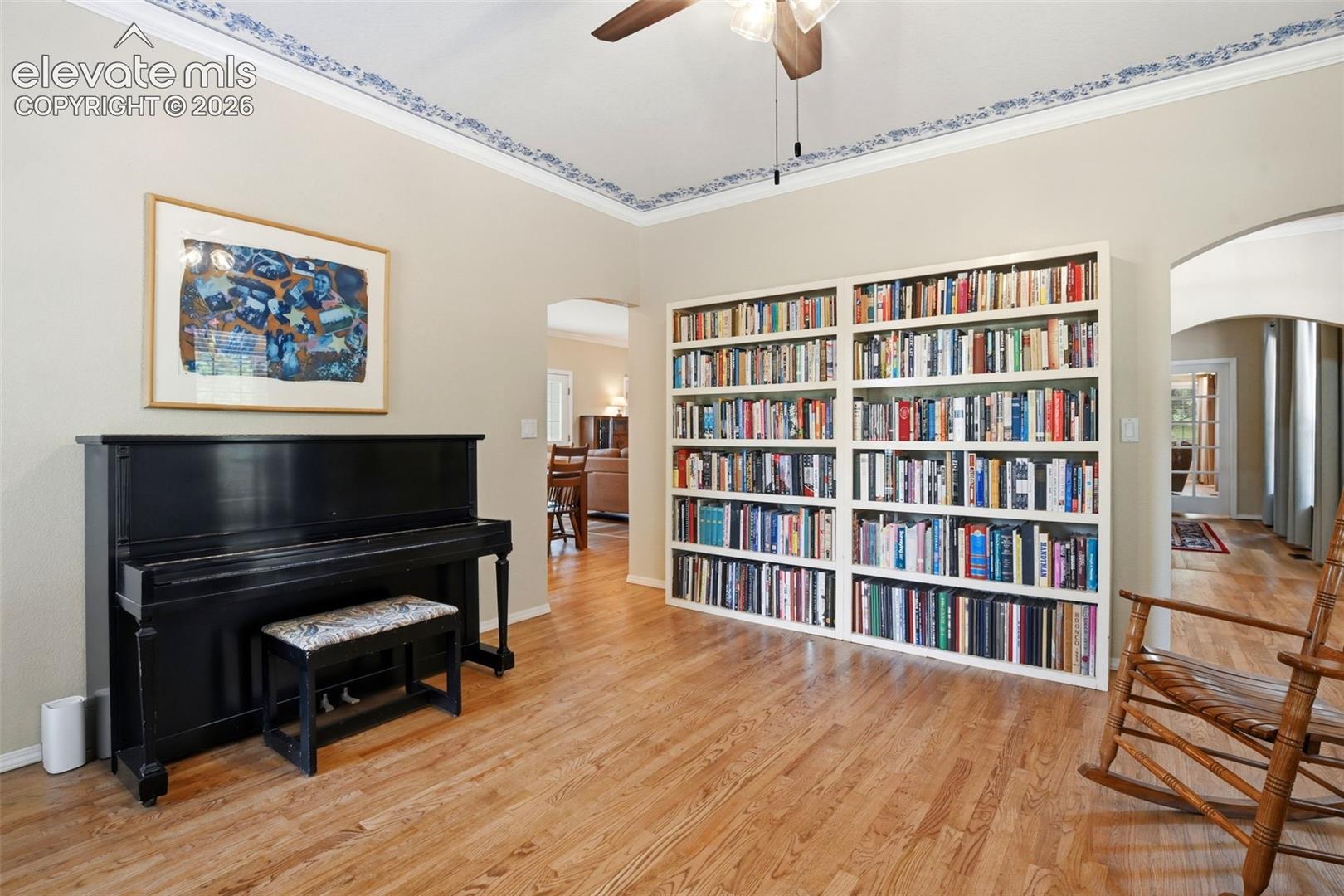 Dining room - currently used as the music room/ Library -  arched doorway opens to the kitchen