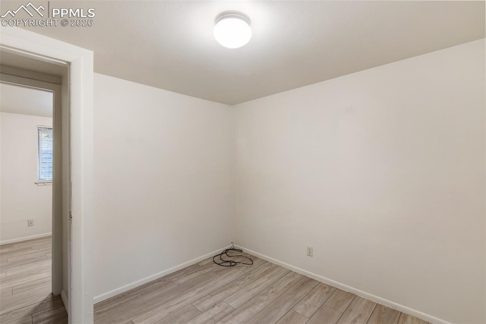 One of 2 bedrooms with easy maintenance LVP flooring