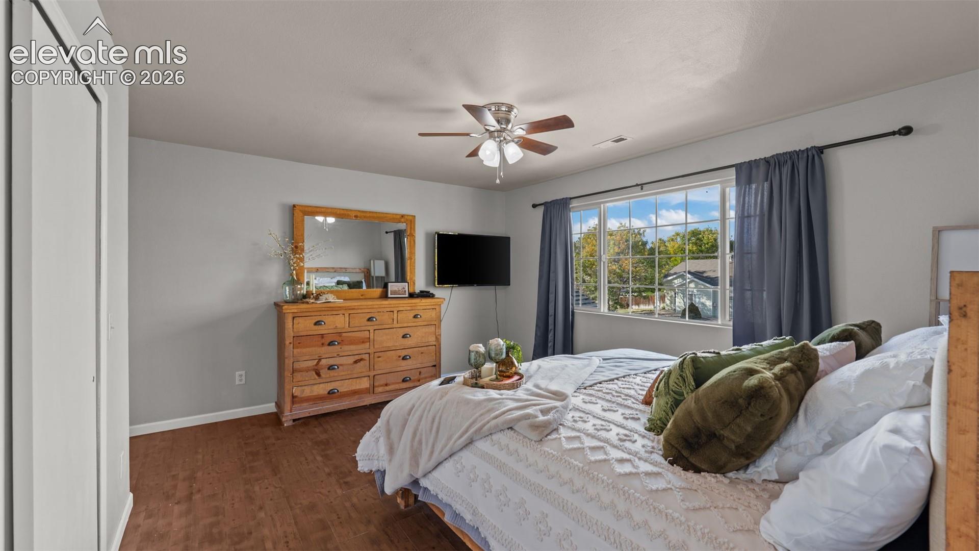 Wood-finish flooring with light gray walls