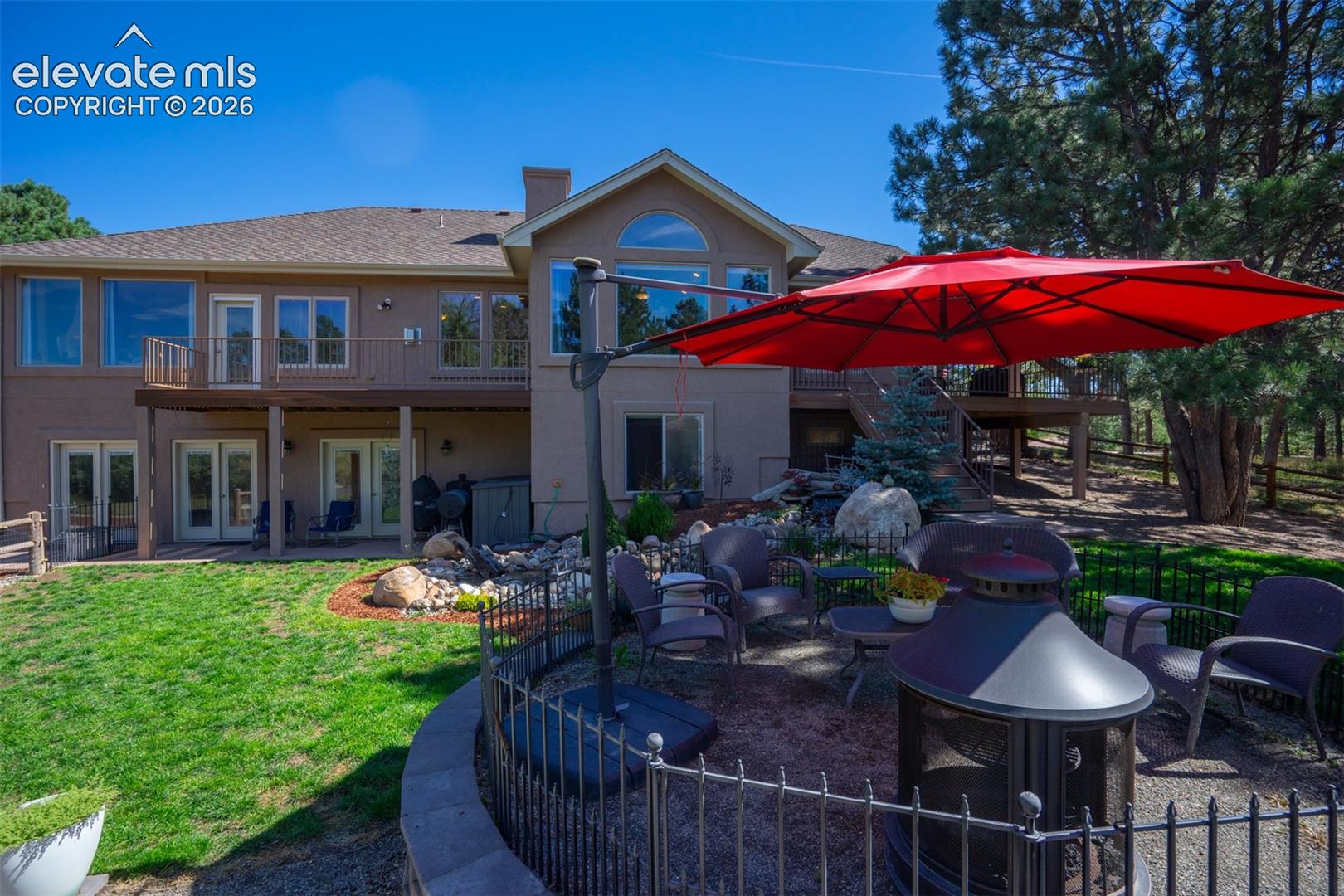There are multiple patio spaces for gathering friends and family. This one is in the main part of the backyard