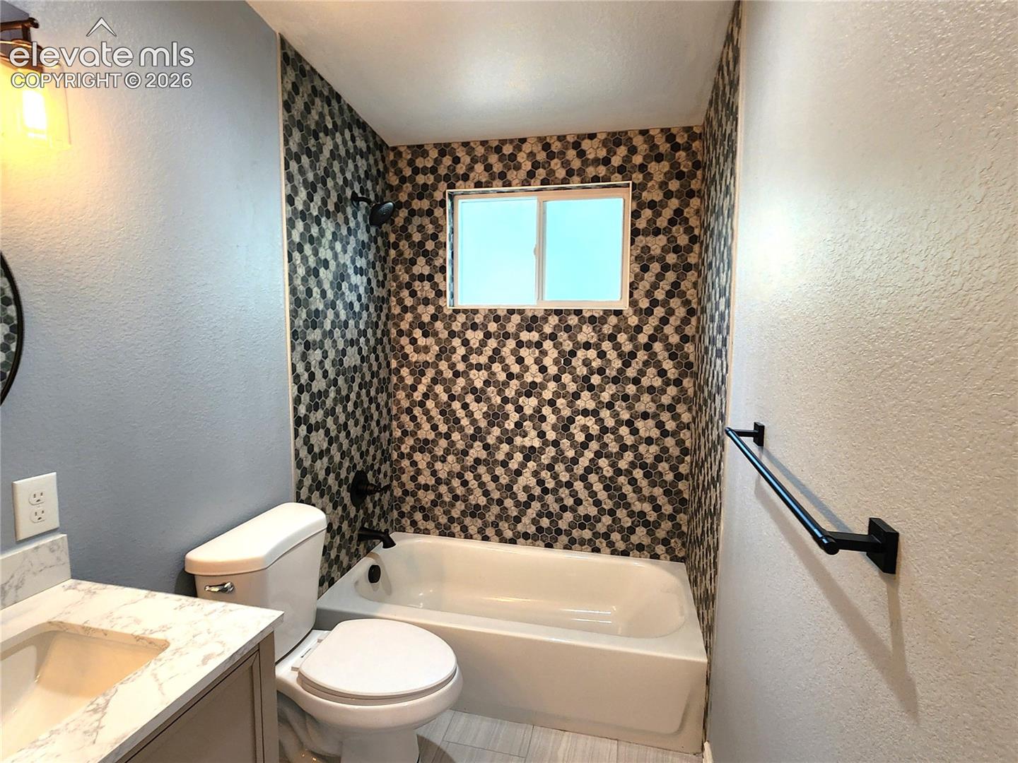 Clean and stylish primary bathroom