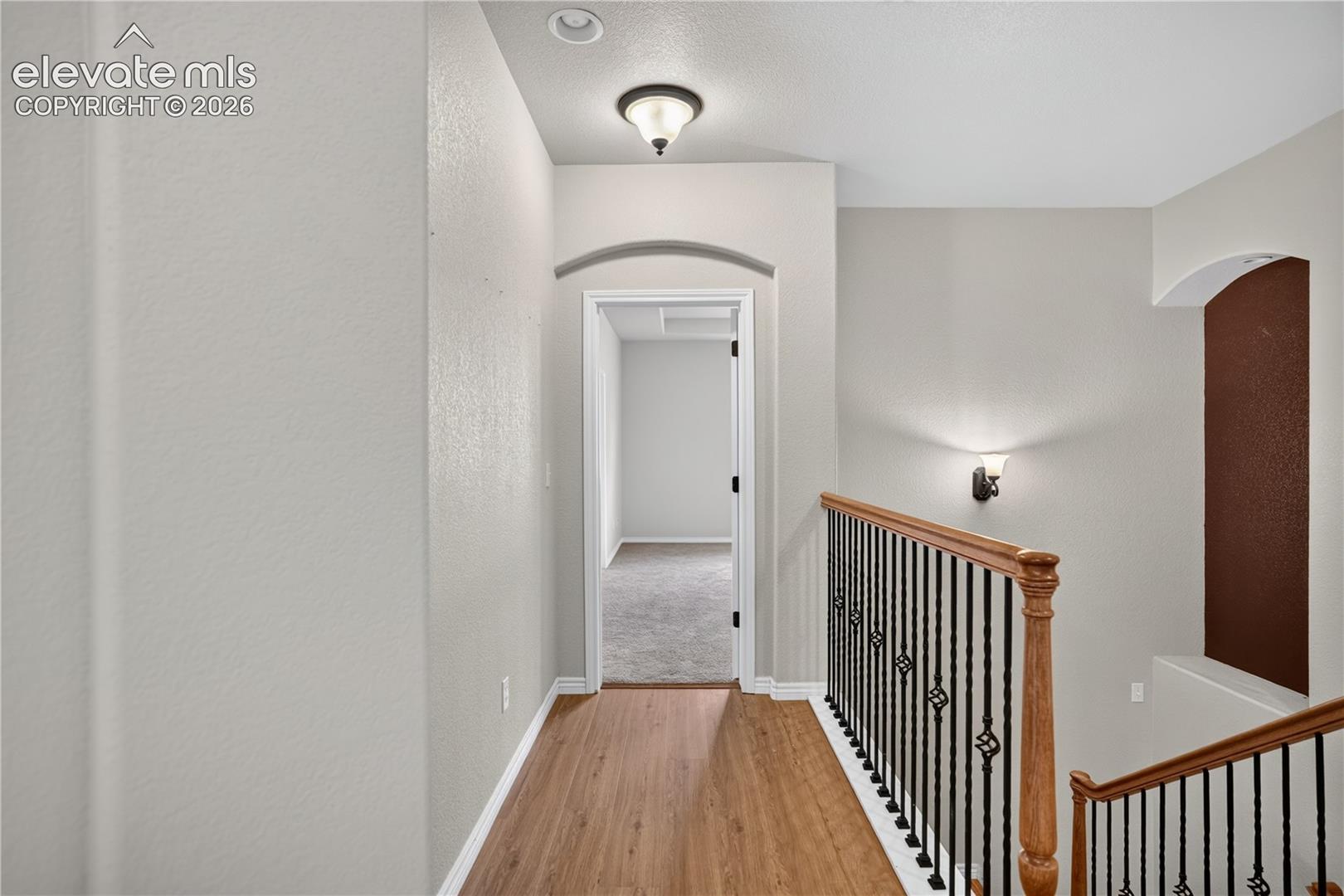 Upper hallway to primary bedroom, new LVP!