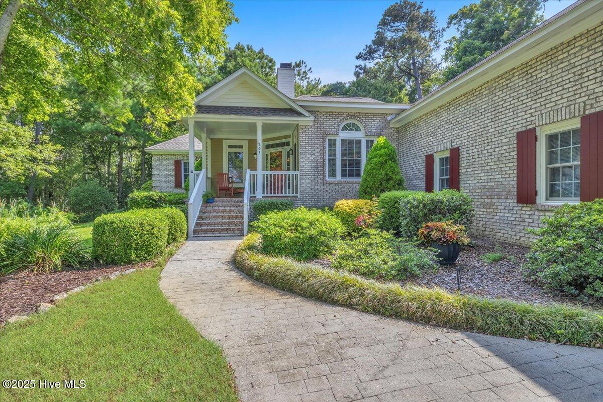 301 Wisteria Way, Caswell Beach, NC 28465 – photo 4: 06-Final 301 Wisteria Way Caswell Beach-