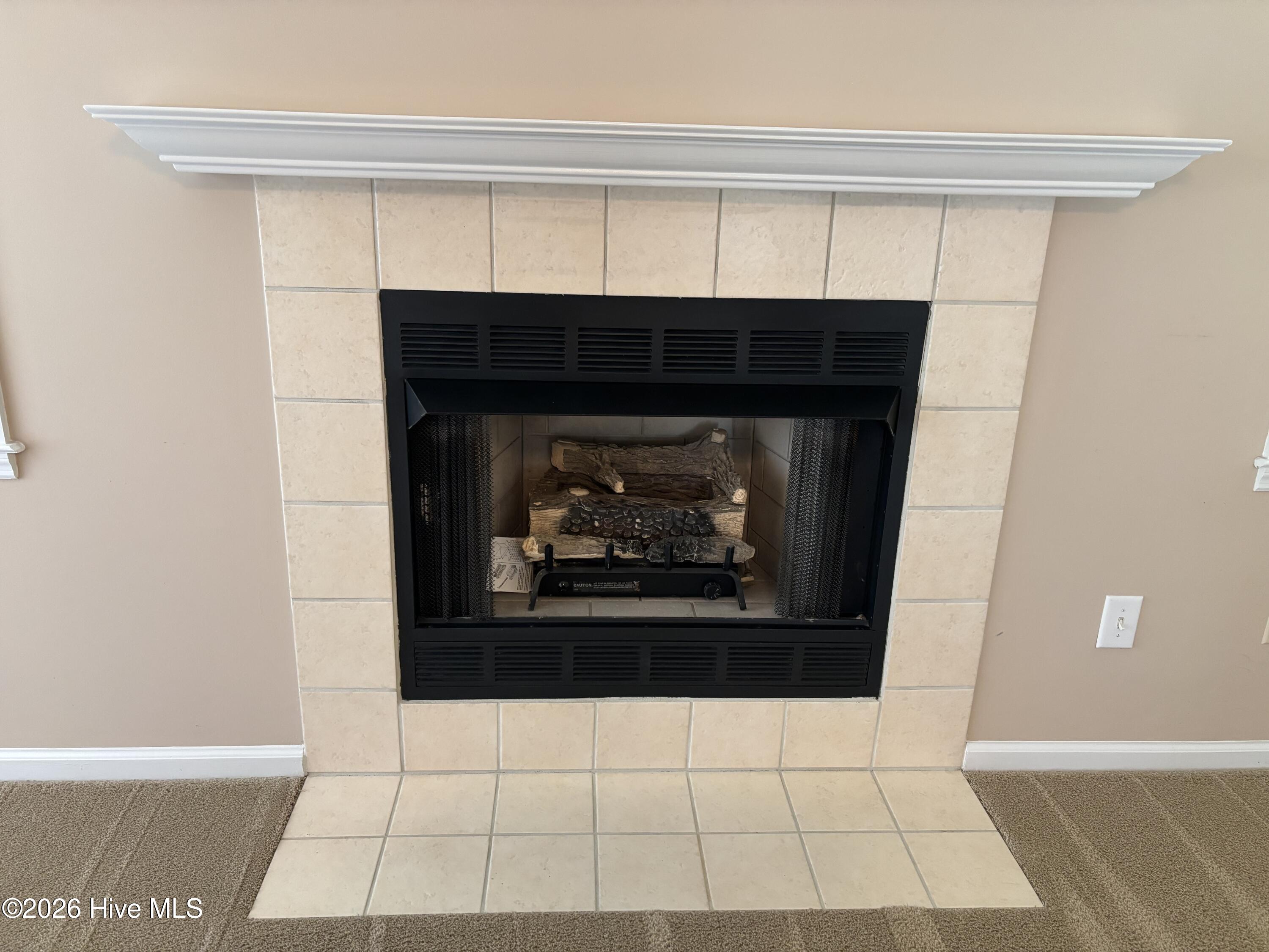 Cozy gas log fireplace in great room