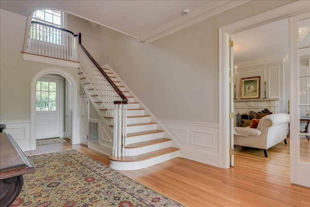 Foyer with staircase, view into Living Room