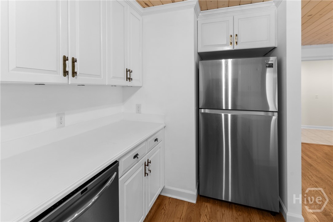 Lots of cabinets and stainless appliances