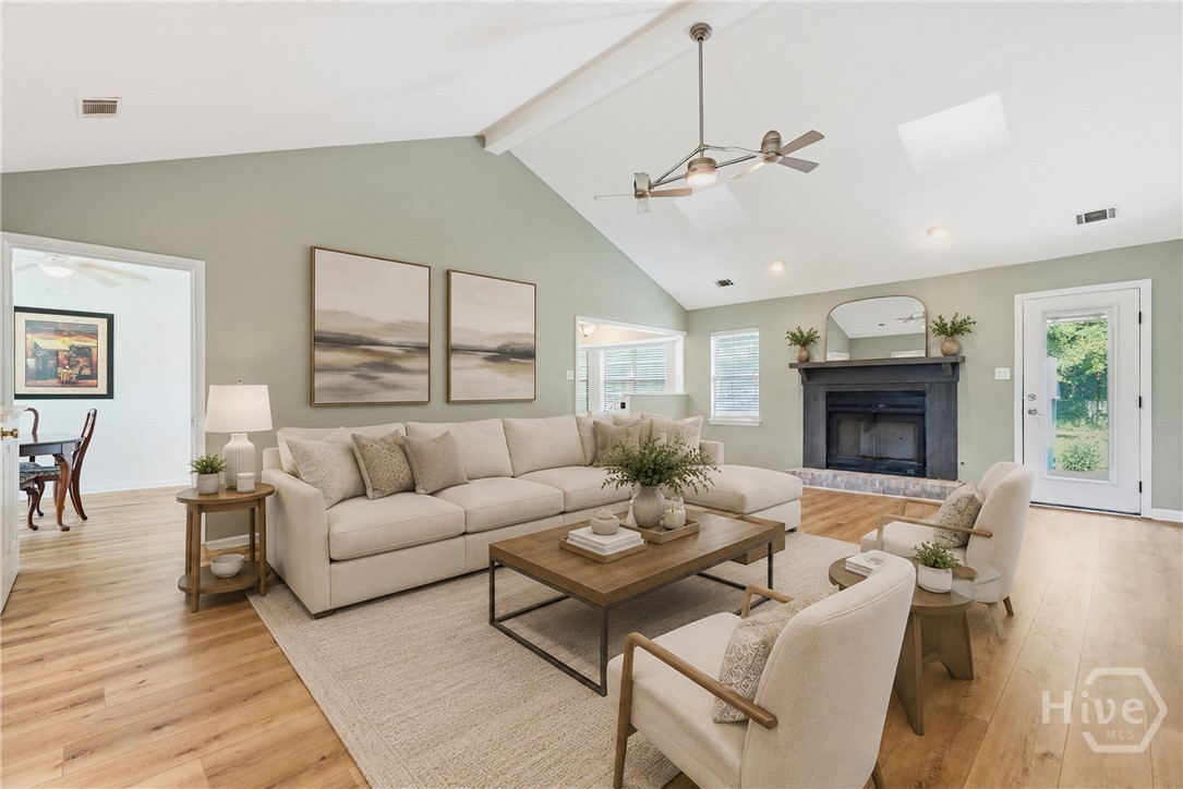 Great room features cathedral ceilings and a cozy