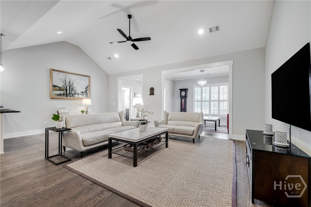 Great Room - with view of back foyer, Carolina Room and entrance to Primary suite