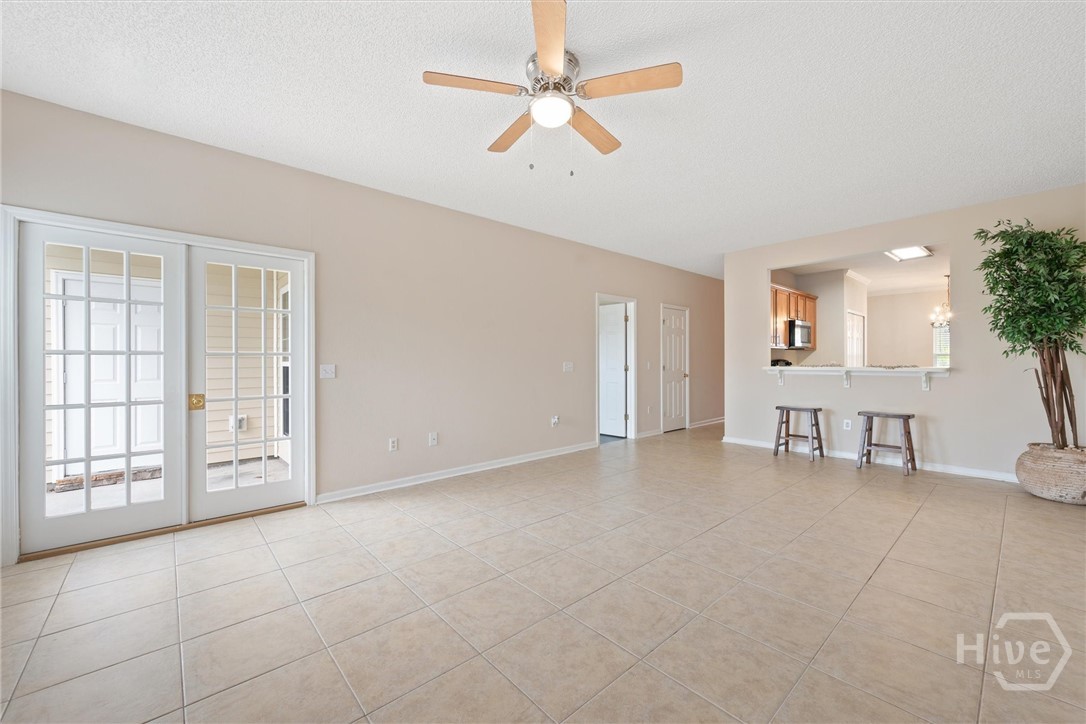 Spacious great room with tile flooring.