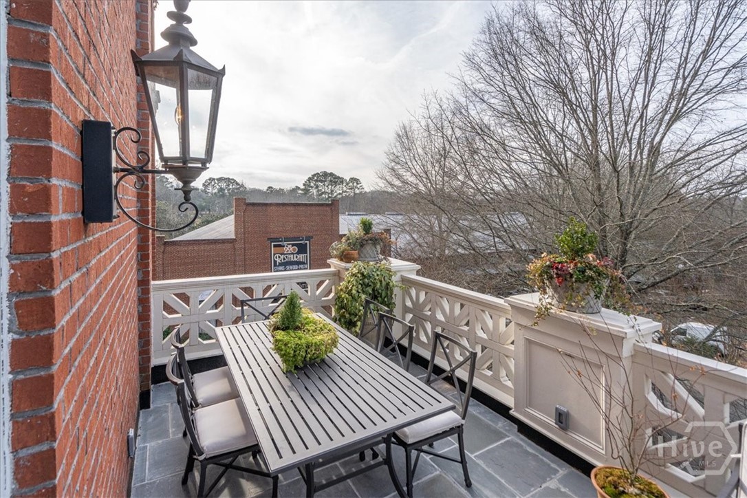 Open up the double doors and carry the fun outdoors to the main balcony