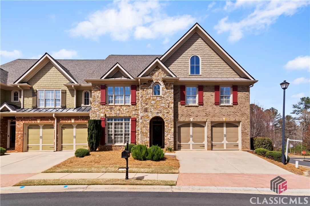 If you've seen this Luxury Condo before, look again! Check out the new basement upgrades to include new LVP flooring and fresh paint! Welcome to 1372 Buckingham Court, located in Oconee County's coveted gated community The Courtyard at Rowan Oak. A beautiful fountain and manicured landscaping welcome you at the front gate and continues throughout the neighborhood. This condo is located across from one of several greenspaces and a block from the entrance to the expansive walking trails private to the residents of Rowan Oak. xxA solid Oak front door leads to the foyer with soaring ceilings that continue into the Greatroom along with wide-plank Oak flooring. Just off the foyer is a home office with attached full bathroom. The formal dining room features wainscoting and coffered ceiling. Bright and cheery Greatroom is flooded with with tons of light thanks to the floor-to ceiling-windows. Plantation shutters, 20ft+ vaulted ceiling with trim accents, and a grand fireplace add to the elegant feel of the home. An open concept kitchen features every appliance one could desire - to include a convection wall oven, gas oven/ range, built-in microwave, French Door refrigerator, and trash compactor. The rear deck overlooks a courtyard style fenced yard that is the perfect size for a manageable flower garden. Owner's Suite features a triple window with custom shutters, trey ceiling, ensuite bathroom with whirlpool tub & separate shower, and walk-in closet with closet system. After ascending the stairs to the upper level, you'll see an expansive landing that overlooks the foyer & Greatroom via multiple archways. There are multiple closets and a study nook with built-in desk in the landing as well. Each bedroom on the upper level has its own ensuite bathroom and multiple large closets. The terrace level was recently updated with fresh paint and Luxury Vinyl Plank flooring throughout. Terrace level is essentially its own suite with interior and exterior access, den with fireplace, bedroom, full bathroom, tons of storage, and another room that could be utilized as an exercise room or fifth bedroom.Enjoy all of the amenities of The Courtyard and Rowan Oak - to include a pool, tennis courts, walking trails, green spaces, gated entry, and yard maintenance. The Courtyard at Rowan Oak is conveniently located near Epps Bridge Center, grocery stores, HWY 316 and US 78, and Downtown Watkinsville. Schedule your private tour and see this wonderful condo for yourself!
