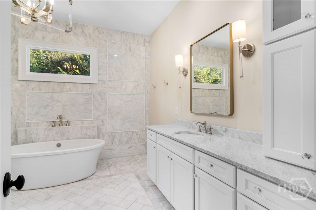Free standing soaking tub in primary bath