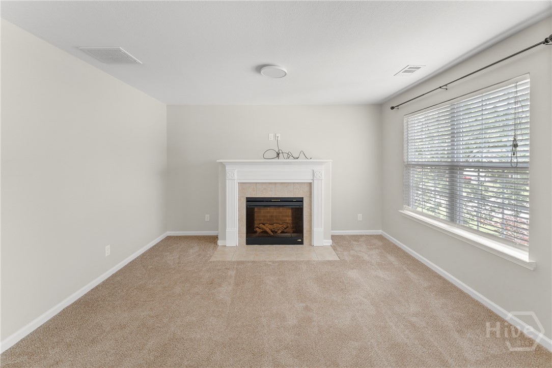 Primary sitting area w/fireplace