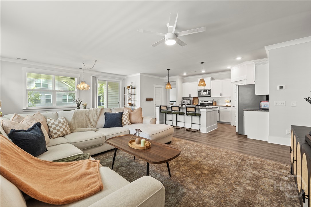 Downstairs living room area opens to kitchen and d