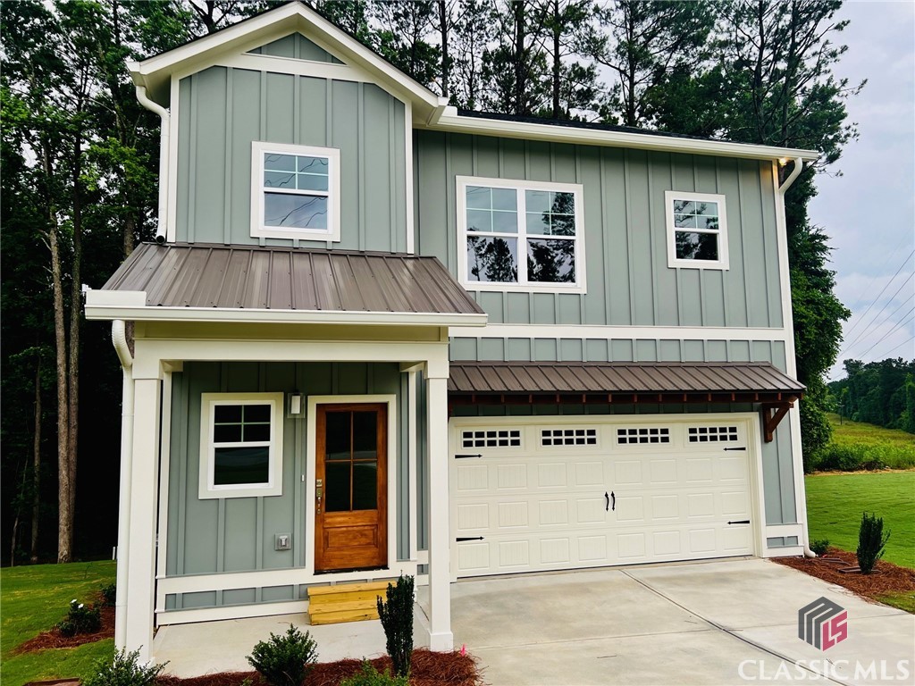 New Construction, Contemporary 4/3.5, 2-story home over a large finished basement, with attached 2 car garage,  2 porches, on large lot, located approximately 2 miles from Downtown, UGA campuses, Piedmont hospital, near Sandy Creek Nature Center, Holland Park Youth Sports Complex, access to Greenway Trail, and located within Chase Street, or Johnnie Lay Burks, Elementary district. Also, the Jittery Joes Roaster/coffee house/art gallery is next door, and Terrapin Brewery is 2 blocks away, so 2 staples of a good life in Athens are walkable destinations. This is an area that is fast evolving as an extension of Intown, remarkably convenient to everything that makes Athens a highly desirable place to live. This is one of 4 recently completed new homes on this block, each move-in ready. Additionally, with multi-family zoning, these homes could be used as AirB&B or VRBO sites.      This home features an open concept common living area on the main floor. The living room has a fireplace, and connects to a stylish kitchen, dining room, and a large back porch that sits up high, overlooking back yard and wooded rear lot. The kitchen features a large island with pendant lighting, quartz counters, tile backsplash, a pantry, and stainless appliances. Upstairs, there are 3 BRs, including a large master suite with walk-in closet, and a laundry room. The finished basement is a large open space, with a wide array of potential uses. It includes a 4th bath, and access to back yard. This is a lot of square footage, functional space, and lot, for the price