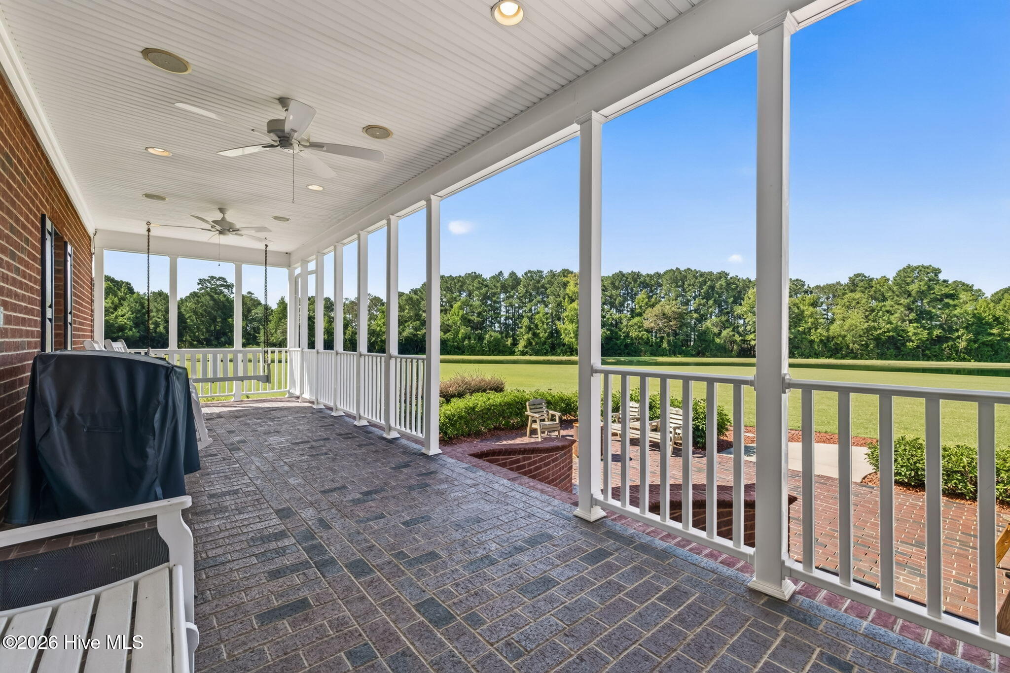 Back Porch Main Residence offers Spectacular Views of the Pond with Fountain