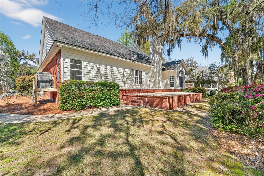 check out the back patio with views out to the beautiful, mature azaleas.