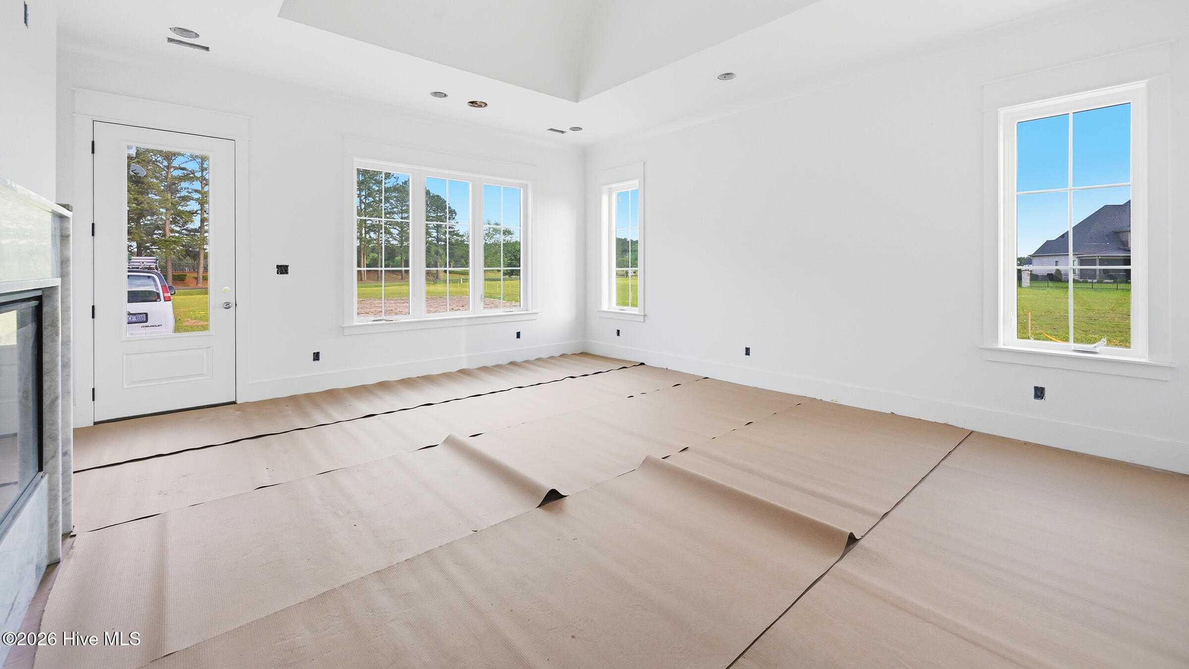 Downstairs owner suite - has a beautiful arched -coved ceiling, exit to back and a fireplace