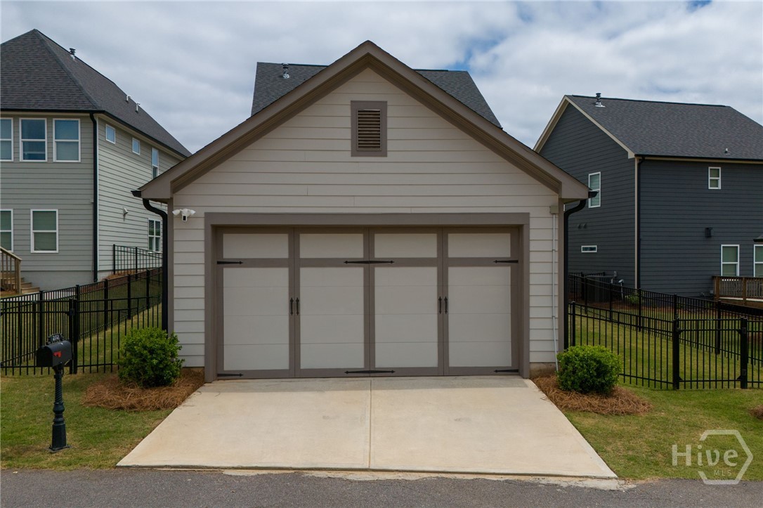 2-Car Garage: Accessed via a convenient rear alley, this detached two-car garage is exceptionally deep and easily accommodates a full-size truck.