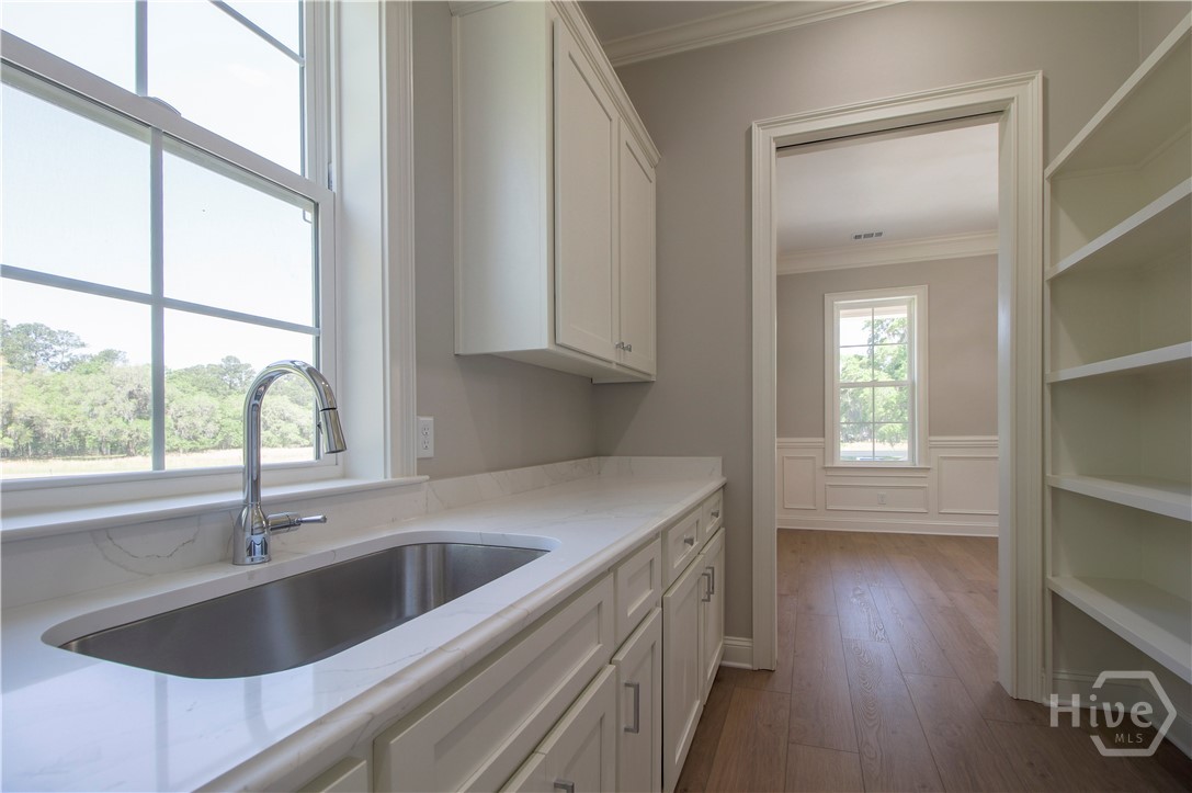 Amazing wet bar/butlers pantry/shelving storage between kitchen and dining room.