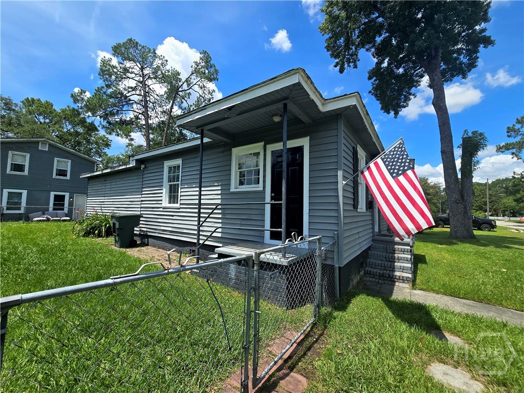 side entrance, fenced yard