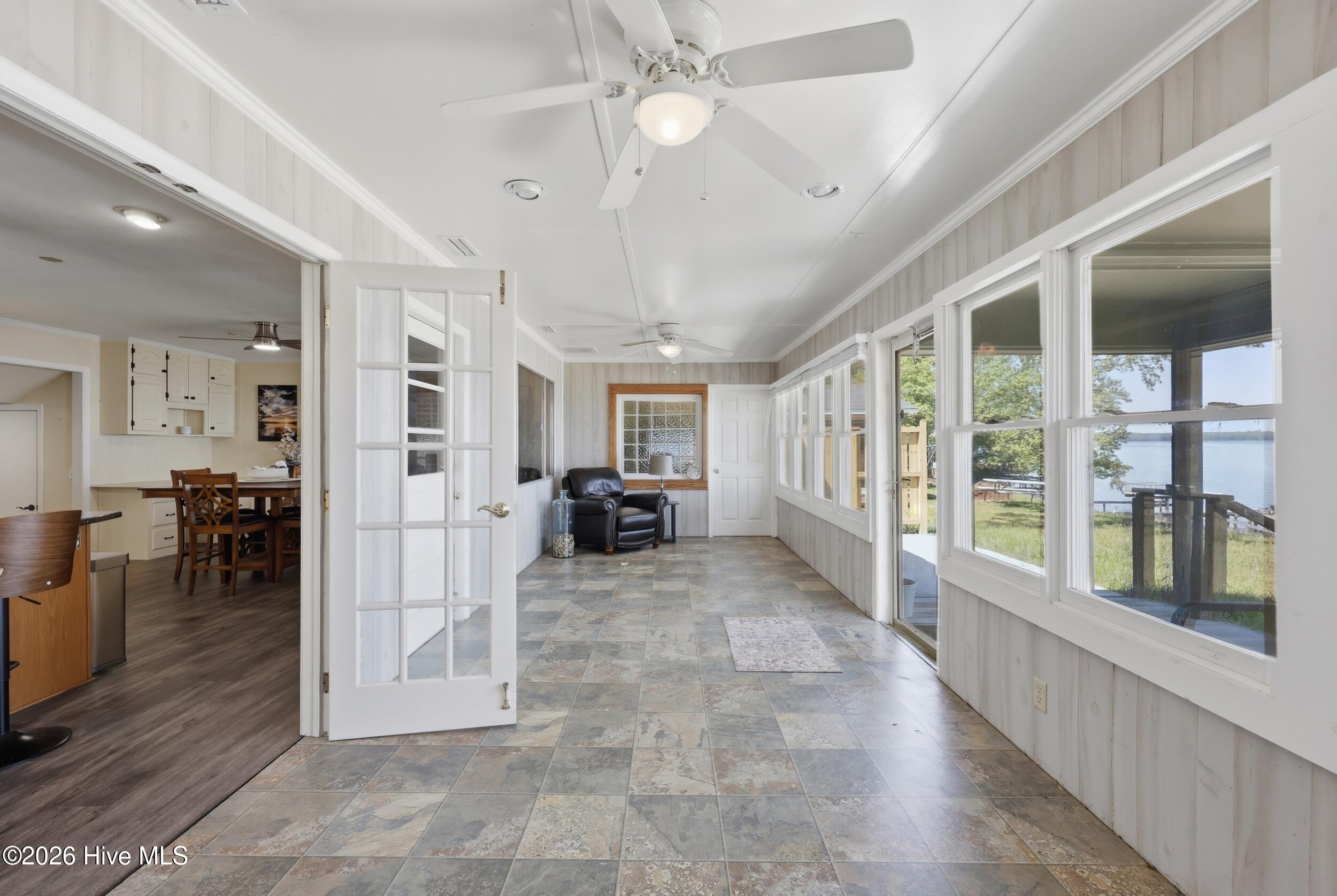 Huge sunroom, ample room dining table and lounging furniture