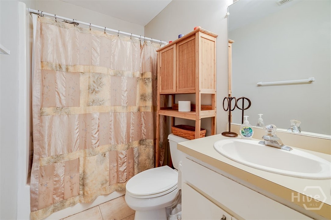 Second full bathroom with a tub/shower combo.