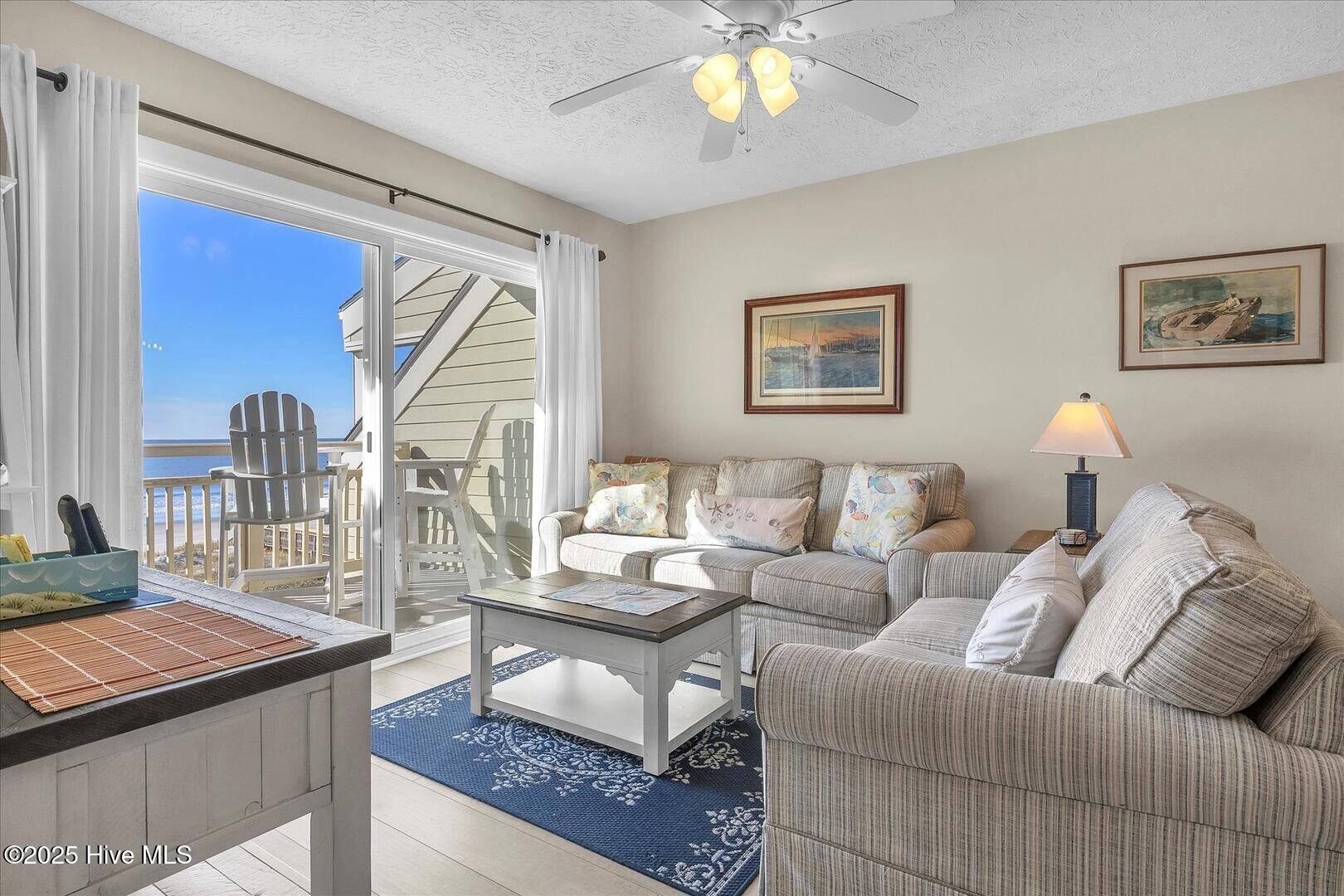 1000 Caswell Beach Road, Oak Island, NC 28465 – photo 14: 1000 Caswell Beach Road 1303 Living Room