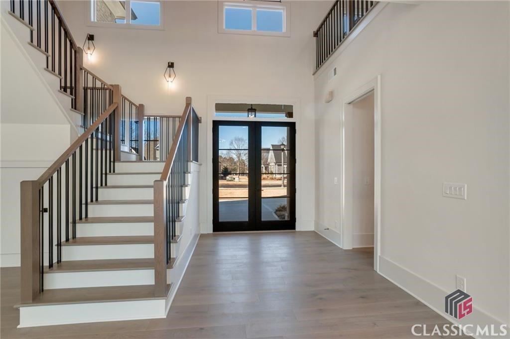 Entry - Impressive Foyer with Glass Doors