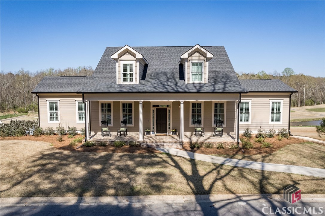Step inside this stunning 2021 construction located in the Jennings Mill neighborhood in Watkinsville!! With 5 bedrooms, 4.5 bathrooms, over 5364 heated sq ft of living space, and a 1075 sf three-car garage, this three-story home has it all.Enjoy plenty of sunshine beaming through the windows while overlooking the 12th hole of the Jennings Mill golf course. On the main level, you'll find a large family room, an open kitchen, and breakfast area, a formal dining room, a 1/2 bath, an oversized laundry room, and the primary suite with an attached office and dual closets. The primary bath has separate vanities, a large shower, a separate soaking tub, and a private water closet. The kitchen is sure to please with a large island, tons of great cabinetry, stainless appliances, and a gas cooktop. Upstairs, two large bedroom suites each with its own ensuite bathroom and a second laundry area!This classic home is a real showstopper! Not only does it boast an amazing basement with tall ceilings, two secondary bedrooms, a full bathroom, and a small kitchenette with a roll-up glass window to the exterior pool bar, but it also has a beautiful in-ground pool right off the basement - perfect for a summertime dip!But wait, there's more! This property also has not one, not two, but THREE covered porches! The main level porch even has its own fireplace - perfect for cozy nights outside! So if you're looking for a home that's fun and functional, this one is sure to make a splash!
