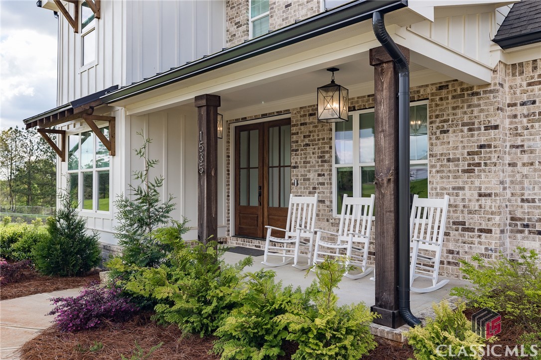 Motivated Seller!   Welcome to this gem of a home, perfectly designed for comfort and versatility! This spacious residence accommodates everyone and every activity—whether it's workouts, gatherings, or working from home—while maintaining a warm, inviting atmosphere.The main level features a formal dining room, a stylish bar, and a beautifully appointed kitchen that opens to a wonderful great room complete with a cozy fireplace. Kitchen highlights include sleek quartz countertops, a gas range, an oversized island, and custom cabinetry, making it a chef’s dream.The generously sized Owner's Suite boasts a large walk-in closet and a spa-like bath featuring double vanities, a spacious tiled shower, and a soaking tub—your private oasis! An additional bedroom with an en suite bath is also located on the main floor, ideal for guests or family.Stay organized with a convenient drop zone at the garage entry, along with a well-equipped laundry room and a half bath to complete this level. With 10-foot ceilings, hardwood floors, recessed lighting, and an abundance of natural light flooding in, the main floor feels both airy and inviting.Step outside to the covered porch off the great room, featuring a fireplace and ample space for seating and dining, overlooking an expansive backyard—perfect for outdoor entertaining!Upstairs, you’ll find three generously sized bedrooms. Two bedrooms share a bath, while one could easily serve as an upstairs owner’s suite. And don’t forget the bonus room! This multifunctional space is perfect for workouts, game nights, movie marathons, or hosting overflow guests.Built by JW York Homes, this residence is situated in one of North Oconee's newer subdivisions, conveniently located near schools, shopping, and Highway 78. Don’t miss this incredible, and affordable, opportunity in Oconee County—schedule your showing today!