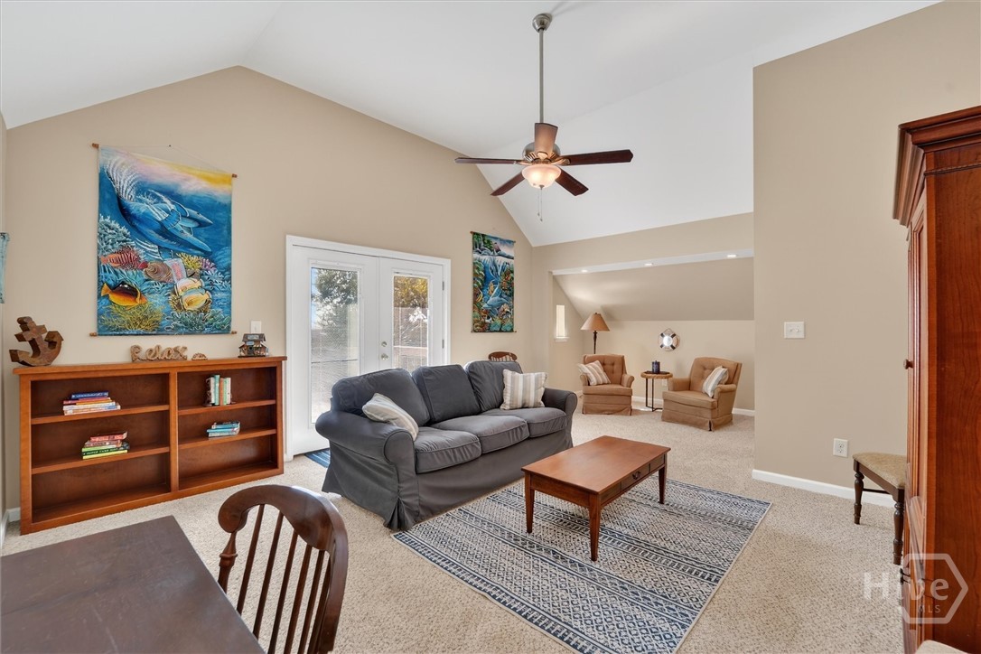 Second floor family room with private balcony looking over the water.