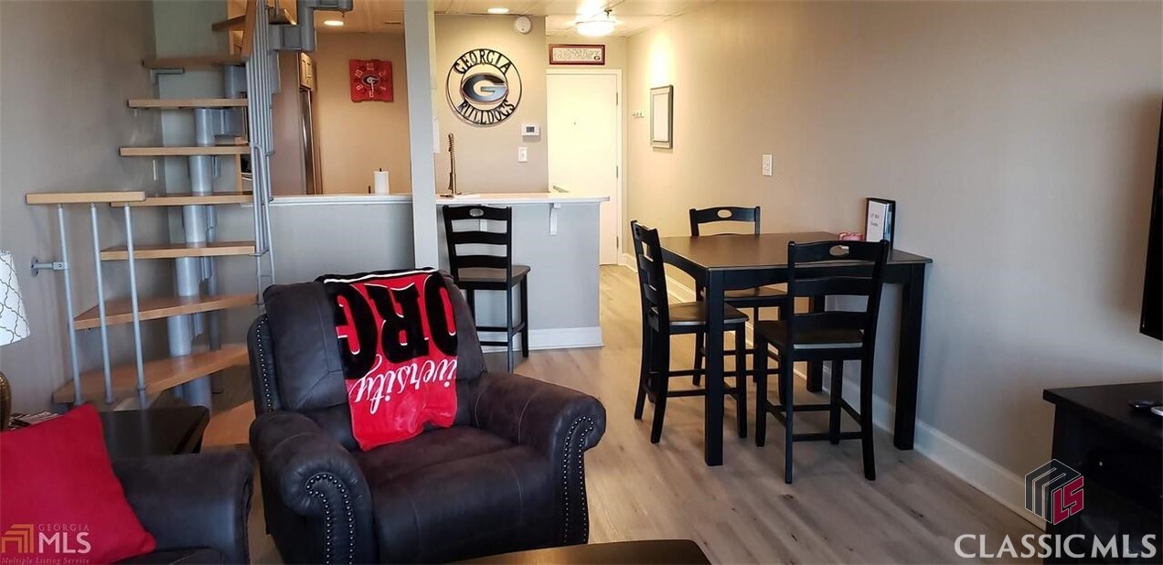 Location is EVERYTHING in this completely renovated and updated penthouse unit on the 9th floor in University Tower with 20' ceilings! Very rare as there are only 2 units in the building that have this layout. Located across from UGA's historic North Campus and one block over from the famous Arch, this unit is in the heart of downtown Athens! New Target now open on the street level of the building. Unit has brand new A/C and water heater, and luxury vinyl flooring throughout. Bathroom and kitchen have been completely gutted and redone, including custom tile work and stainless steel appliances. In addition to student living, this unit would work great for investors, football enthusiasts, and short term rentals. Selling fully furnished. Don't miss this amazing opportunity! Unit is leased through May 2023.