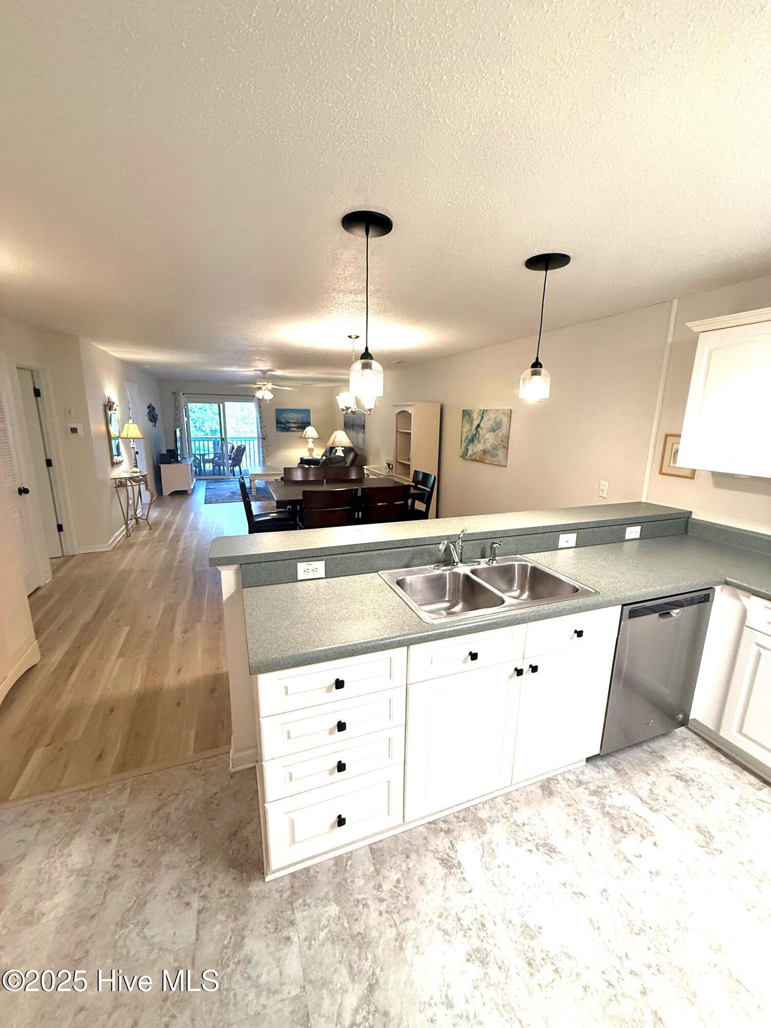 1620 Goley Hewett Road SE Unit 307, Bolivia, NC 28422 – photo 5: Kitchen into living area
