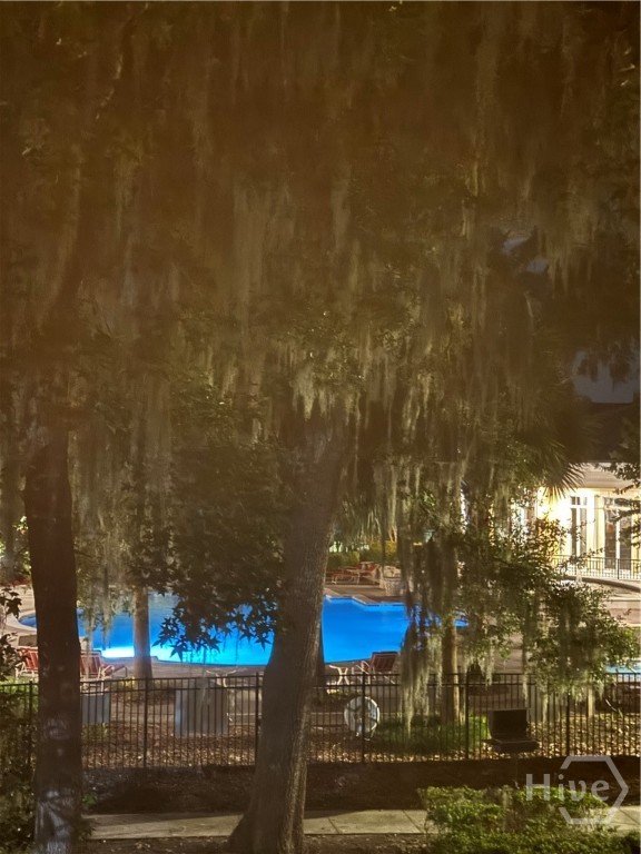 Night view of the pool from the condo