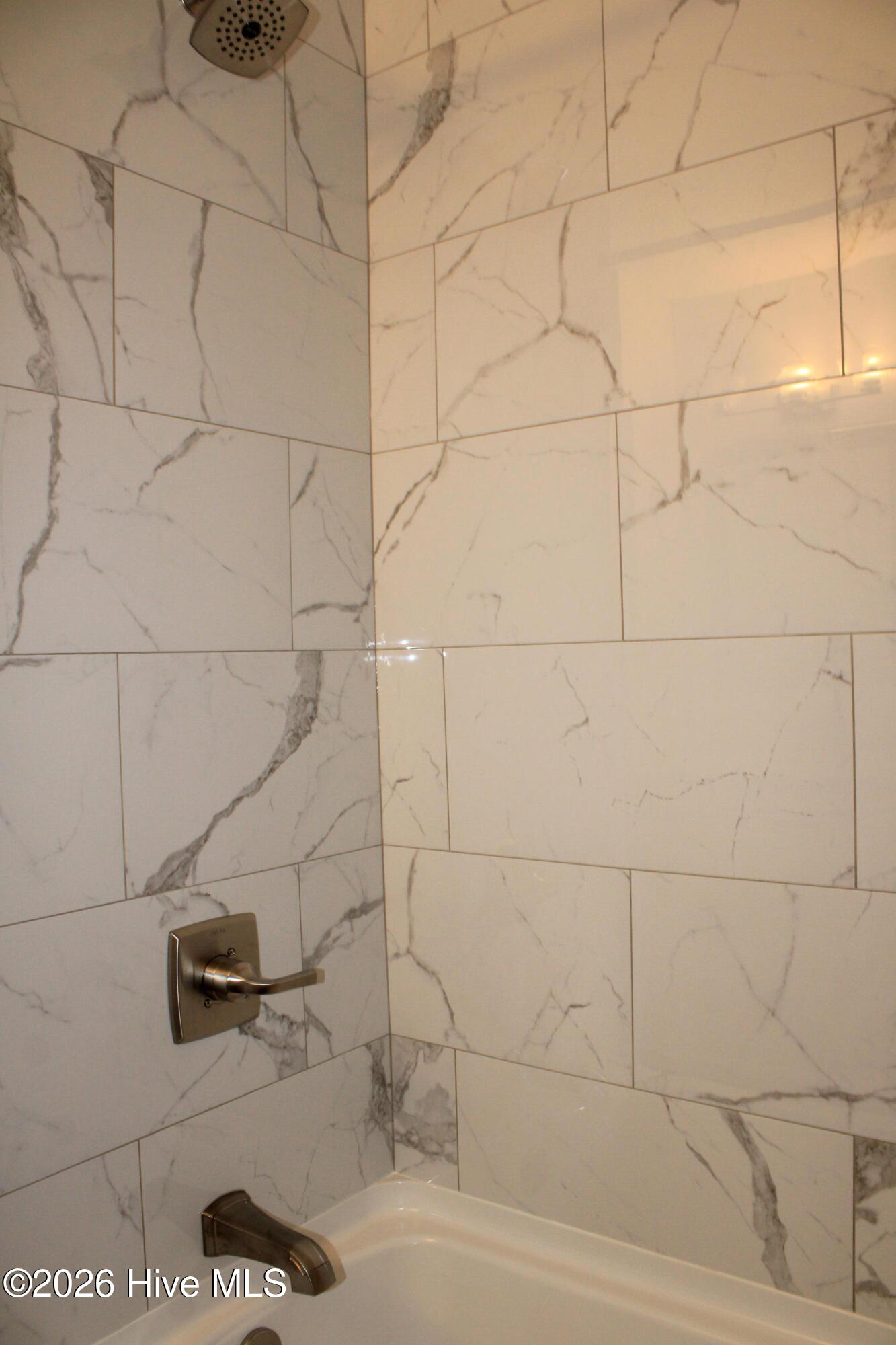 Remodeled bathroom w/ fully tiled shower