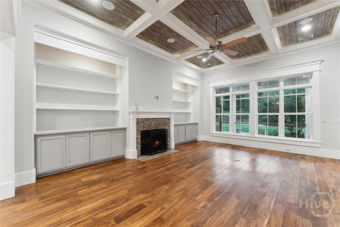 Living room featuring built ins