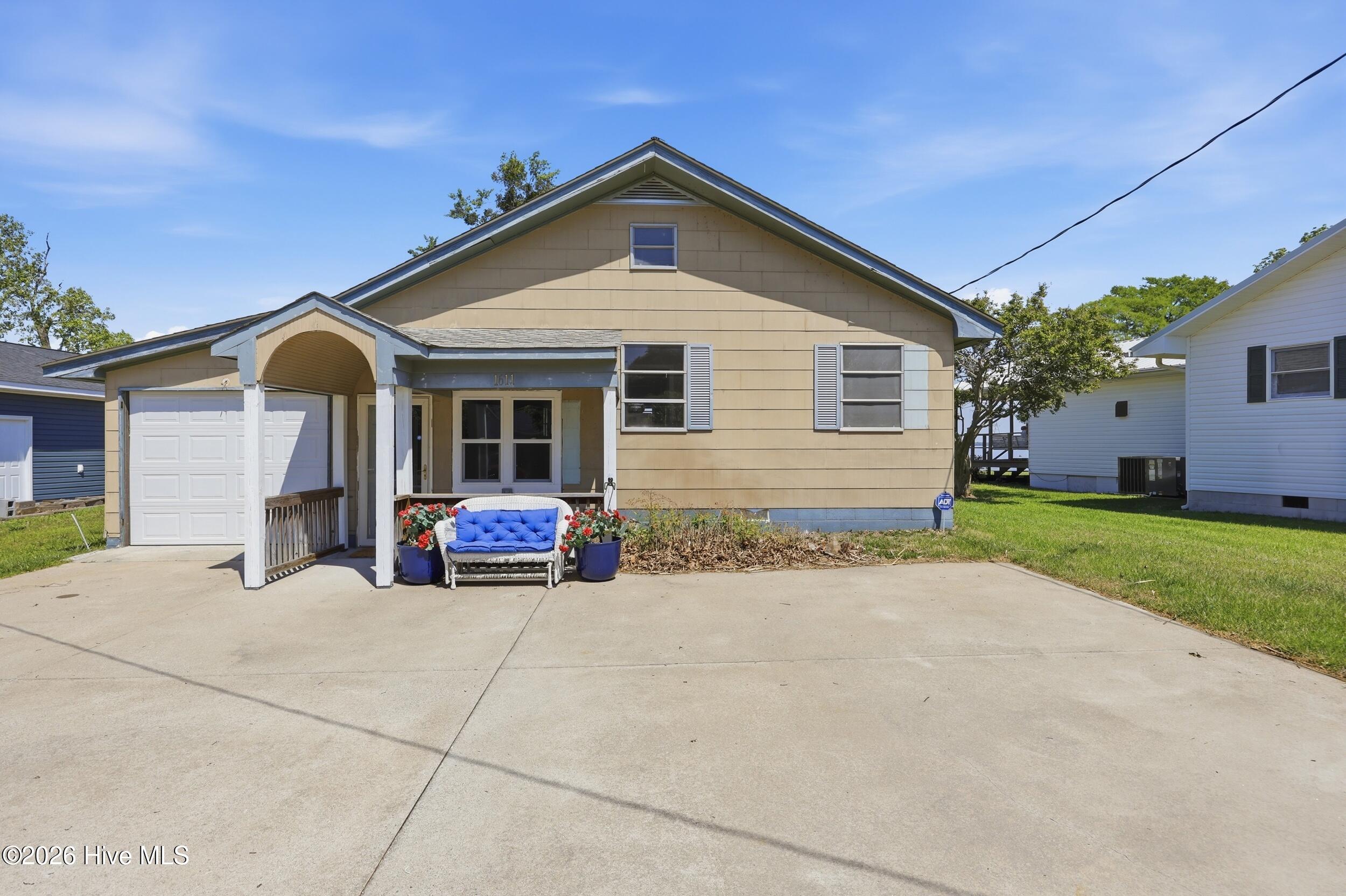 Spacious attached garage, large parking area