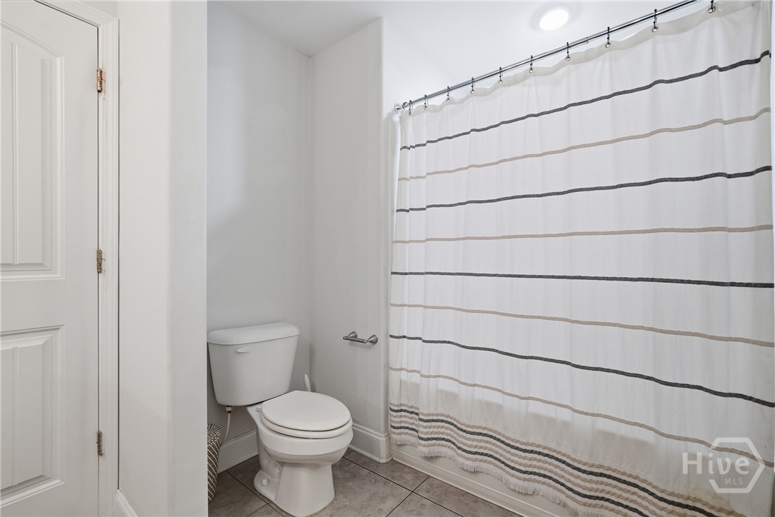 The primary bathroom is large and features a shower/tub combo.